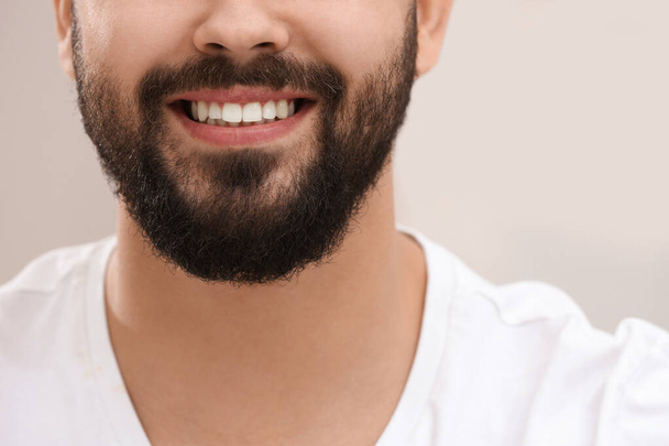 Happy young man with white teeth, closeup - Foto, Bild