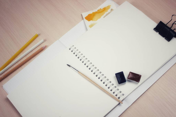 Layout of art materials at an angle, mockup notebook for inserting illustrations - Photo, Image