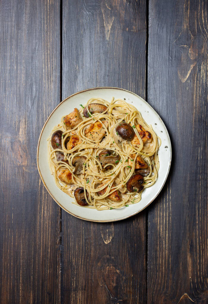 Pasta spaghetti in a creamy sauce with chicken and mushrooms. Italian food - Fotó, kép