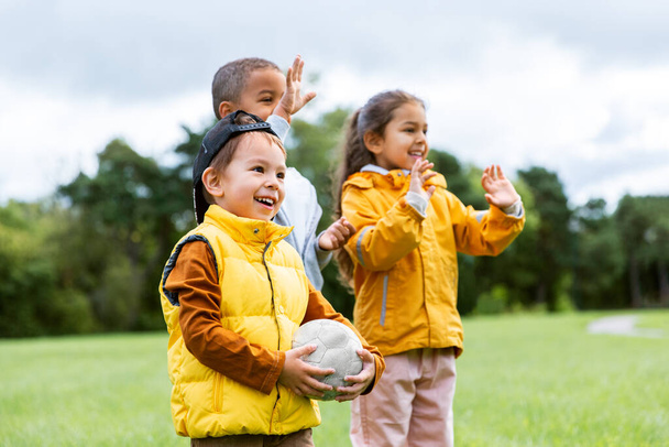 happy children with soccer ball at park - Foto, Imagem