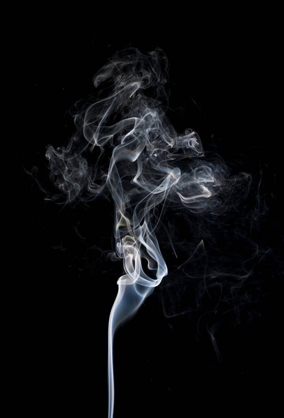 Abstract white smoke swirls on black background. Close-up. - Foto, Imagen