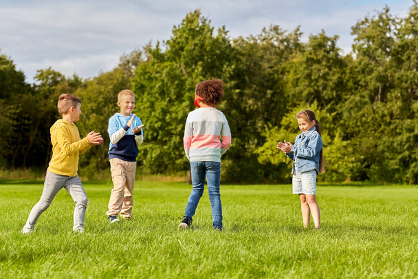 happy children playing and running at park - Valokuva, kuva