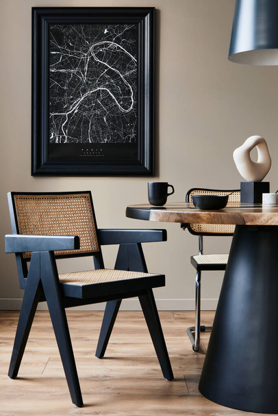 Modern composition of dining room interior with design wooden table, stylish chairs, decoration, teapot, cups, vessel, commode, black mock up poster map and elegant accessories in home decor. Template - 写真・画像