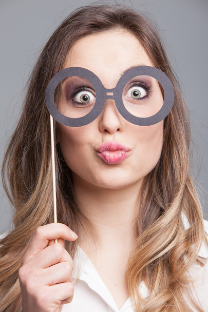 Young woman wearing funny glasses - Фото, зображення