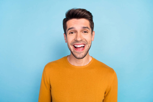 Photo of young cheerful man happy positive smile amazed surprised omg wow excited news isolated over blue color background - Photo, image