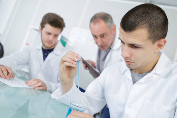 male medical or scientific laboratory researchers performs tests - Foto, Imagen