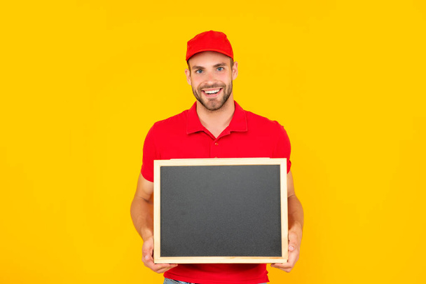 happy man in cap with blackboard. guy make announcement. - Photo, image