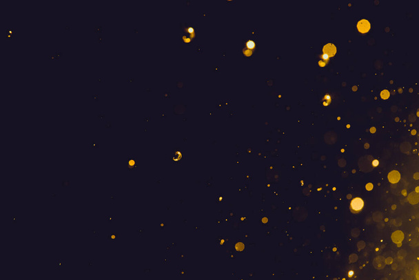 Абстрактний золотий боке на чорному тлі
 - Фото, зображення