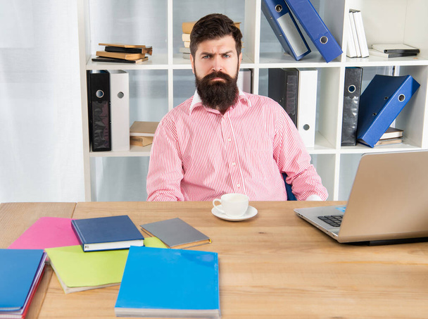Serious office worker. Businessman sitting at desk. Office work - Fotoğraf, Görsel