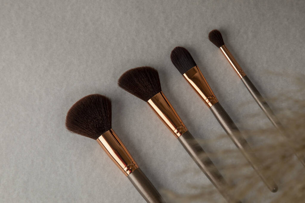 Makeup brushes with a blur in front and copy space - Photo, Image