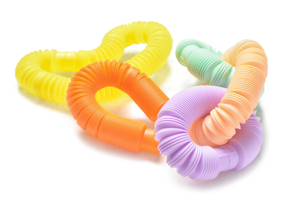 Different colorful Pop Tubes on white background - Photo, Image
