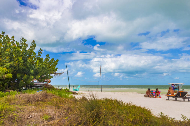 Holbox Mexico 22. December 2021 Panorama landscape view on beautiful Holbox island sandbank and beach with huts palapa and sun loungers and blue sky in Quintana Roo Mexico. - Фото, зображення