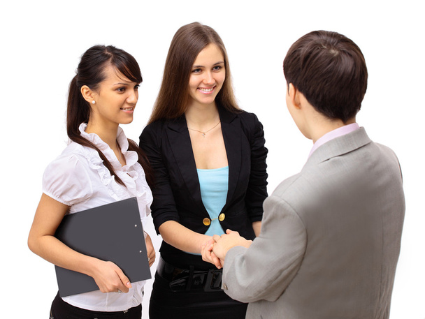 Attractive man and woman business team shaking hands at office building - Фото, изображение