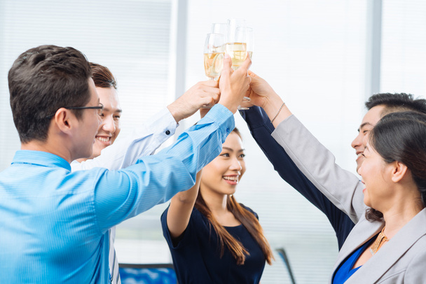 Successful business team clinking glasses - Photo, Image