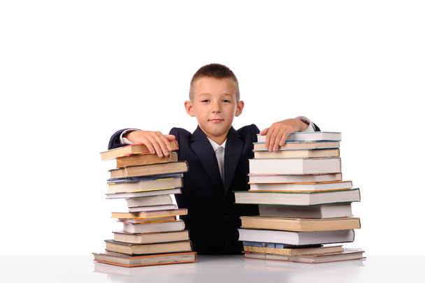 Schoolboy with huge stack of books - Zdjęcie, obraz