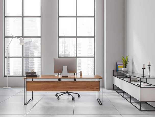 Light workplace room interior with wooden table and computer pc, decoration on commode, grey tiled floor. Panoramic window with Singapore skyscrapers, 3D rendering - Valokuva, kuva