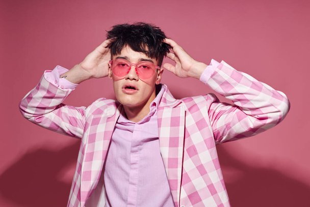 pretty man plaid blazer pink glasses fashion modern style pink background unaltered - Foto, Imagen