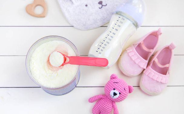 baby bottle with milk on white background. Selective focus. - Foto, Bild