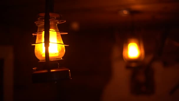 Close-up of a classic incandescent lamp. Glass bulb, inert gas and tungsten filament. Soft natural light. Lamp velvet effect. Is flaring up brighter and brighter. - Footage, Video