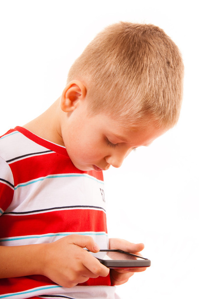 Boy playing games on smartphone - Фото, зображення
