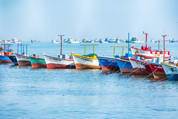 Paracas, Peru - October 2021: Multicolored boats in the bay of Paracas in Peru. - Фото, изображение