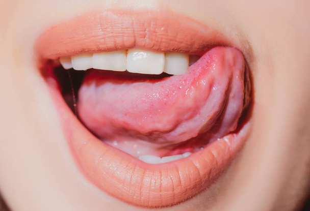 Sexy lips closeup. Sensual open mouth with licking tongue. Seductive lip makeup. - Foto, Imagem