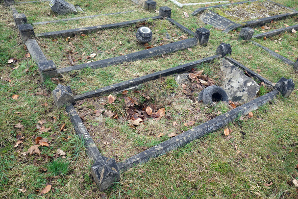 A Old Graveyard with Broken and Fallen Crosses and Graves in Overgrown Grass Spooky - Photo, Image