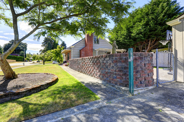 Backyard with stone wall - Photo, Image