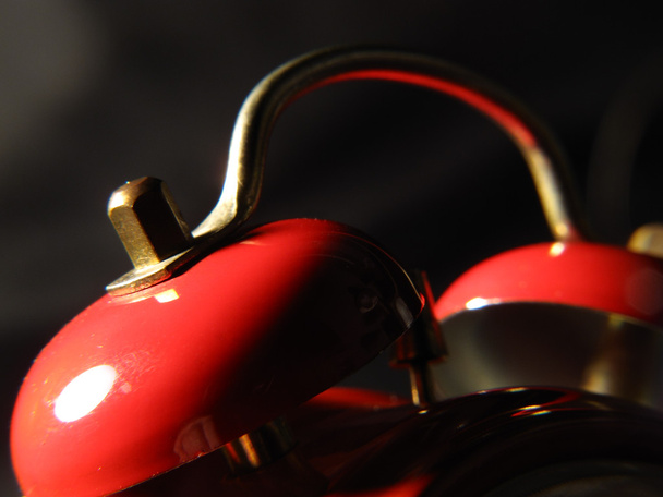 Bells of a former clock alarm clock in red color and black botto - Photo, Image