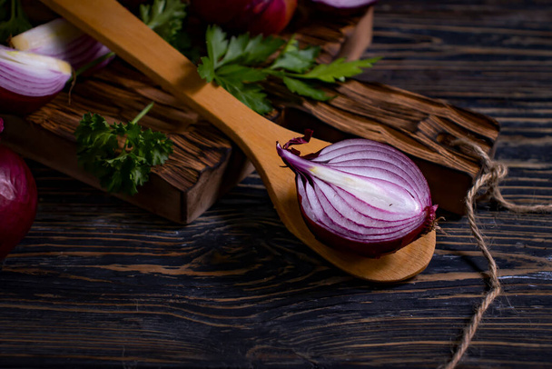 blue onion, parsley on wooden background - Photo, image
