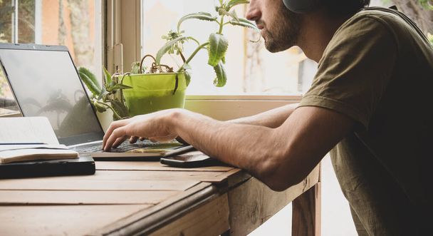 close up of young man dressing casual working on laptop. space for text - Foto, Imagem