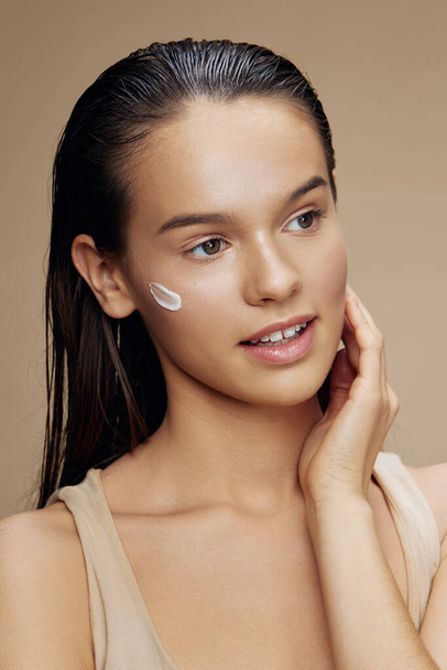 young woman face mask cream clean skin facial scrub close-up make-up - Фото, зображення