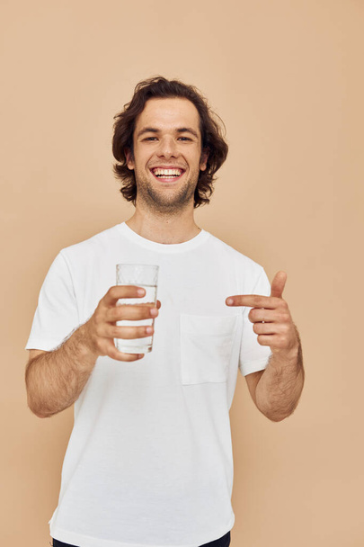 Cheerful man with a mug for a drink Lifestyle unaltered - Foto, imagen