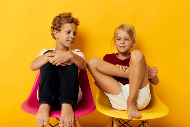 Portrait of cute children smiling and posing in casual clothes against isolated background - Fotoğraf, Görsel