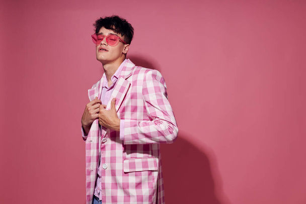 portrait of a young man plaid blazer pink glasses fashion modern style isolated background unaltered - Zdjęcie, obraz