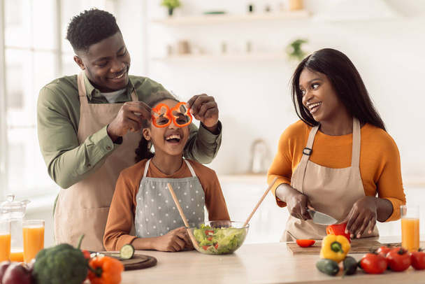 African Family Making Salad Having Fun With Vegetables In Kitchen - Photo, Image