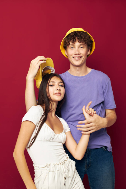 a young couple in colorful t-shirts stylish clothes hats Youth style - Photo, Image