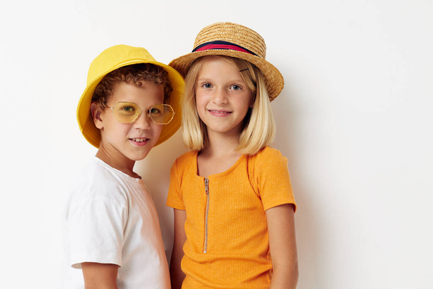 boy and girl wearing hats with phone fashion posing childhood - Φωτογραφία, εικόνα