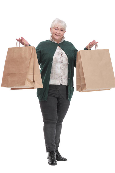 Front view of mature woman shows the paper package - Photo, Image