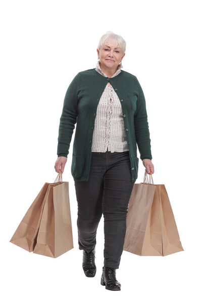 Full body senior woman cheerful and smiling, very excited carrying a shopping bags - Foto, afbeelding