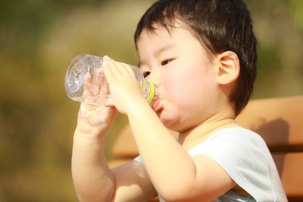 boy drinking water from bottle  - Photo, Image