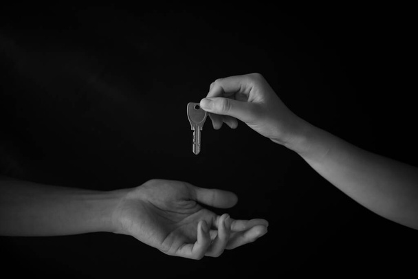 hand handing the master key - Photo, Image