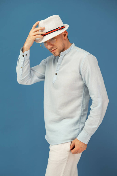 Half length of hipster man who posing in stylish eyewear with elegant hat. Fashion mans look. - Photo, Image