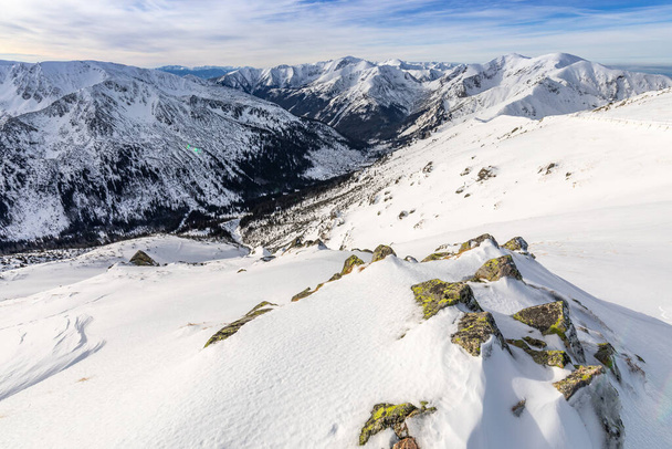 Tatra mountians at winter time. View of the white snow-capped peaks, frosty winter mountains. Kasprowy Wierch, High Tatra, Poland, Europe. - Photo, Image
