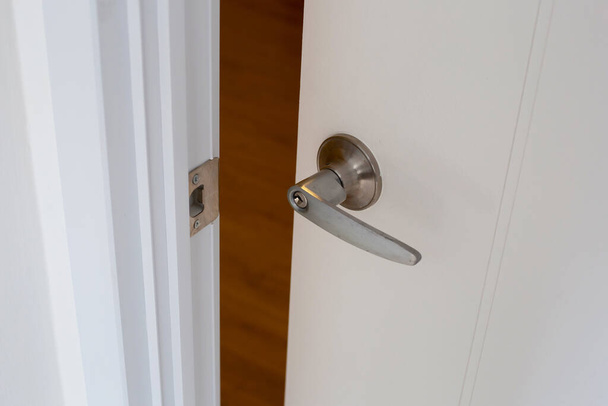 Open door metallic handle room - Photo, Image