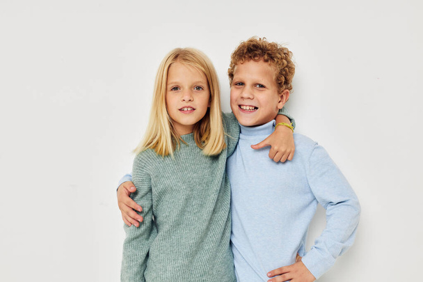 Photo of two children hug entertainment posing friendship isolated background - Fotoğraf, Görsel