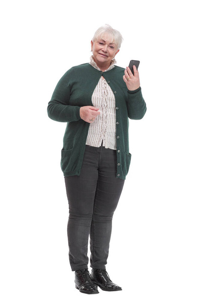 Happy senior woman holding cell phone, smartphone in hand read and write sms - Фото, зображення
