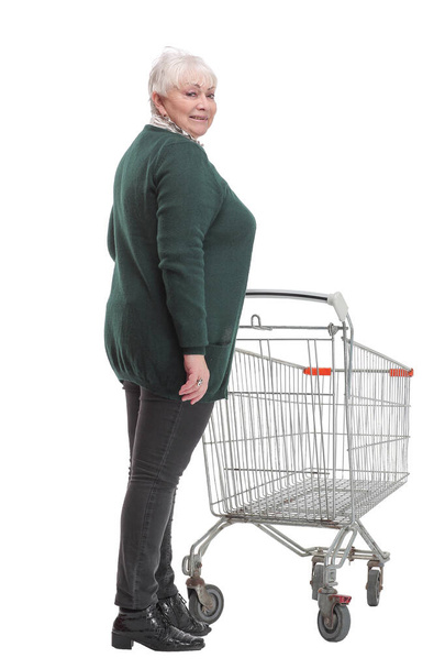 Back view of a woman pushing a shopping trolley - Photo, Image