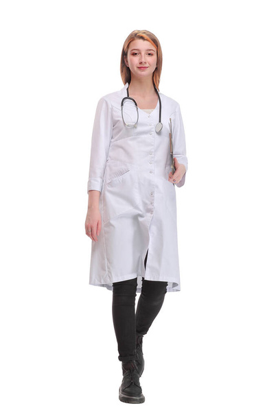 Image of a young female doctor holding a clipboard and walking to the camera - Foto, Imagen