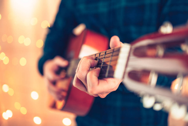 man's hands playing acoustic guitar, close up. Music concept. - Fotó, kép